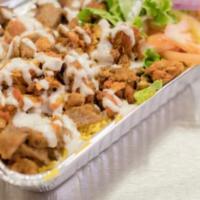 Chicken over Rice Combo · Soft and juicy grilled chicken with specialty seasoning and served with veggies and salad wh...