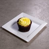 Lemon Drop Cupcake · Vanilla cake filled with tangy lemon, topped with lemon buttercream and a dollop of tangy le...