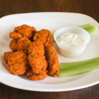 Boneless Wings · 12 PIECE- TOSSED IN YOUR CHOICE OF SAUCE; SERVED WITH BLEU CHEESE AND CELERY
