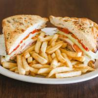 Tuscan Focaccia · Grilled chicken topped with prosciutto, roasted peppers, mozzarella cheese, lettuce, tomato ...