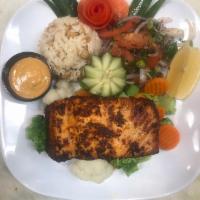 Grilled Fish · Marinated, charbroiled salmon filet served with grilled tomatoes and peppers and a side sala...