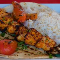 Chicken Kebab · Our house specialty chicken cooked to juicy perfection, served with rice, grilled vegetables...