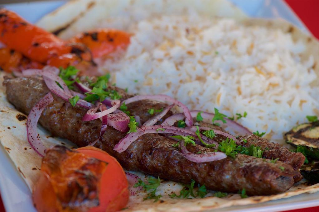 Ground Beef Kebab  · Our juicy lule kebab, served with rice, grilled vegetables and pita bread.