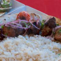 Pork Kebab · Served with rice, grilled vegetables and pita bread.