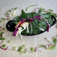Kale Salad · Fresh cut of kale with carrot, purple cabbage, white cabbage. Seasoned with lime juice, oliv...
