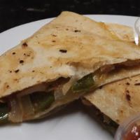 Chicken Quesadillas · Grilled chicken, cheddar cheese, sauteed onions, green peppers and bacon. Side of salsa and ...