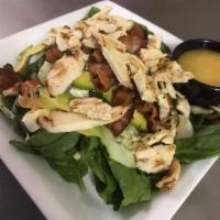 Cobb Salad · Bacon, grilled chicken, avocado, hard-boiled egg, crumbled bleu cheese over a bed of baby sp...