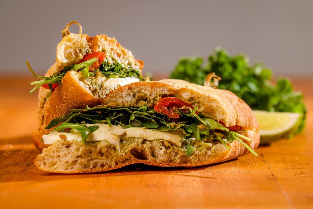 Caprese Sandwich ·  Mozzarella (Vegetarian, Gluten-Free, Fresh Cheese) , Tomatoes , Arugula , with a Avocado Spread , 