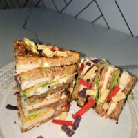 GRILLED CHICKEN TRIPLE DECKER CLUB  · Hormone-Free Chicken, Romaine, Tomatoes, 
Vegan Mayo, on 3 Slices of Plant-Based Bread
