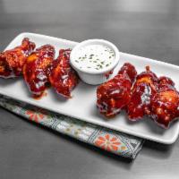 Ragin Cajun Wings · Traditional bone-in chicken wings seasoned, fried, and dipped in your choice of either Buffa...