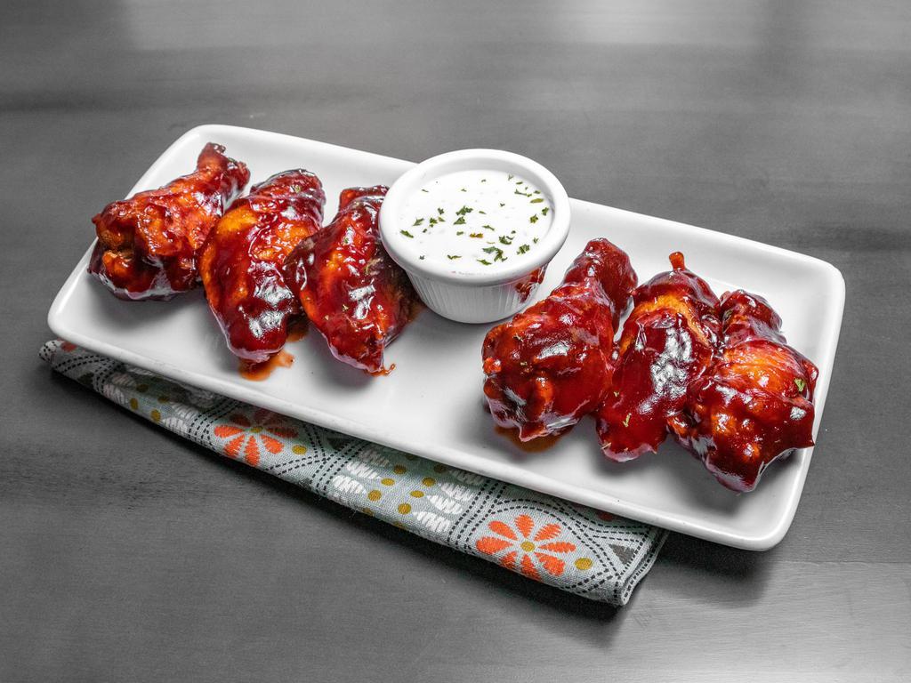 Ragin Cajun Wings · Traditional bone-in chicken wings seasoned, fried, and dipped in your choice of either Buffalo or Honey BBQ sauce. 