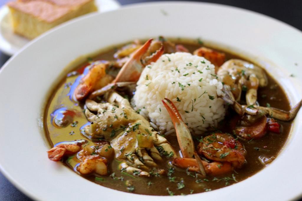 Seafood Gumbo · A Louisiana favorite to include shrimp, chicken, sausage, crab cooked in our famous roux served with rice. 