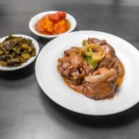 Oxtails · Slow simmered in our Cajun gravy. Includes your choice of 2 sides.