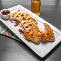 Chicken and Waffles · 2 jumbo fried chicken wings with buttery syrup and a Belgium waffle.