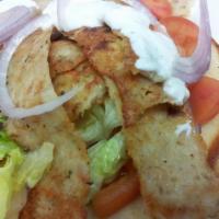 Chicken Gyro Sandwich · Thin slices of chicken wrapped in a pita, with tzatziki, onions, tomatoes, and lettuce.