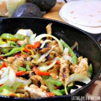 Chicken Skillet · Chicken. Served with sautéed onions, green peppers, tomatoes, and rice. Fajita style.