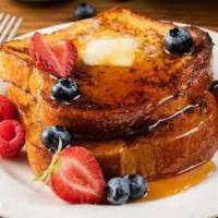 French Toast · 4 thick slices of egg-washed cinnamon toast with maple syrup.