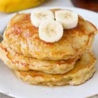 Banana Pancakes · 3 fluffy banana pancakes with maple syrup and butter.