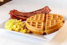 Waffle Combo · 2 scrambled eggs, one large waffle with maple syrup, and your choice of protein.