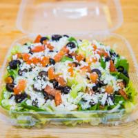 Greek Salad · Spinach, feta, olives, tomatoes, chopped garlic, mozzarella cheese