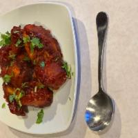 Gobi Manchurian · Deep-fried battered cauliflower florets cooked in a spicy soya sauce.