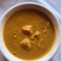 Chicken Dhaniwal Korma · Pieces of chicken cooked with coriander sauce, mint and blend of spices. 
