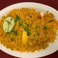 Chicken Biryani · Boneless chicken cooked with basmati rice and traditional spices.