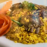 Goat Biryani · Saffron basmati rice cooked with a goat (with bones) marinated in traditional spices.