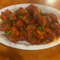 5. Gobi Manchurian · Mini cauliflower florets tossed with tomato, onion, bell peppers, garlic, and green herbs sm...