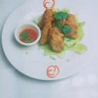 10. Chicken Wings · Served with your choice of sweet-chili or sriracha sauce.