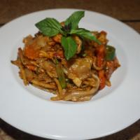 32. Drunken Noodle · Sauteed flat rice noodle with fresh mixed vegetables, egg, fresh basil, and chili, resting i...