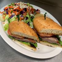 New York Steak Sandwich · 5 oz. New York strip steak, lettuce, red onion  and tomatoes on a French roll.