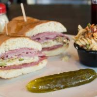 The Highland Sandwich · Italian grinder. Smoked ham, salami, pepperoni, provolone cheese, lettuce, tomatoes, red oni...