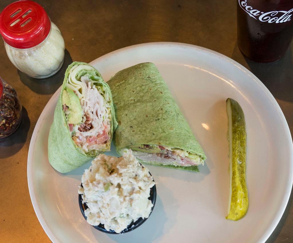 Western Slope Wrap · Smoked turkey, bacon, lettuce, tomato, provolone cheese, fresh avocado and house made ranch dressing. Comes with dill pickle and a choice of chips, house made pasta salad or potato salad.