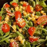 Arugula Salad · Arugula, ceci garbanzo beans, strawberries, coratina extra virgin olive oil and balsamic lig...