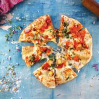 Tikka Pizza · Tikka Sauce, garlic, fresh mozzarella, red onions, tomatoes on a Naan crust topped with cila...