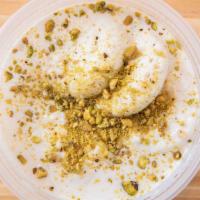 Ras Malai · Fresh cheese patties served cold in sweetened milk garnished with pistachios