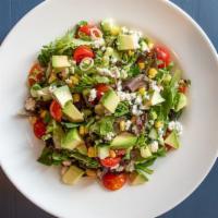 Chopped Salad · Mixed greens, cherry tomatoes, cucumber, corn, green onions, avocado, bleu cheese crumble, b...