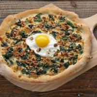Sunny Side Up · Mozzarella cheese, parmesan cheese, spinach, sunny side up egg, pecans.