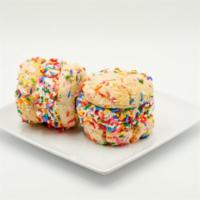 Birthday Cake Ice Cream Sandwiches (2-Pack) · Funfetti Cake Cookies, Vanilla Ice Cream, Rolled In Rainbow Sprinkles.  Brings two sandwiches.