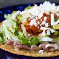 Veggie Tostada · Served with Rice, Beans, Cheese, Lettuce, Tomato and Sour Cream