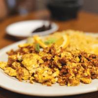 Huevos con Chorizo · Scrambled Eggs mixed with Mexican Sausage, Served with Rice and Beans