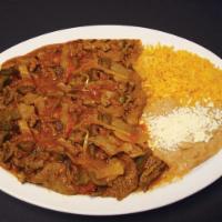 Bistec a la Mexicana · Steak, grilled veggies and ranchero sauce. Served with Rice and Beans