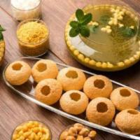 Pani Puri	 · Tiny round hallow crispy puri, filled with delicious stuffing then dipped in flavored juice.