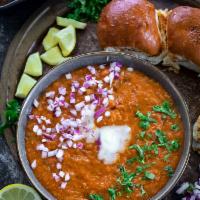 Pav Bhaji · Spicy and smoothly mashed thick vegetable curry served with soft bread roll.