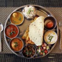 Mini Thali Combo · Can be enjoyed with 2 rotis, white rice, special rice, 4 entrees, curd rice, papad, salad an...