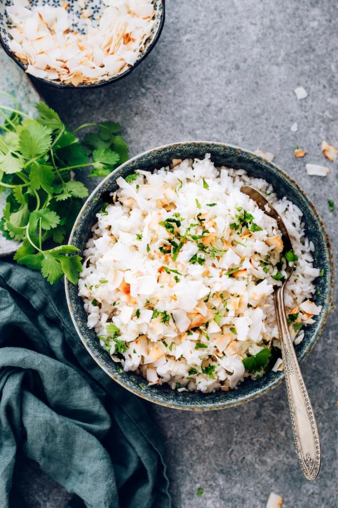 Coconut Rice · Flavorful rice dish with grated coconut and tempered with spices.