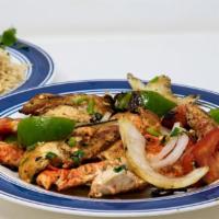 Salmon Fish · Amazing grilled salmon fish which is served with your choice of rice, spaghetti or chapati.