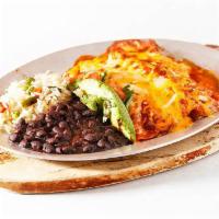 Enchiladas · Your choice of protein wrapped in 2 corn tortillas topped with handmade salad, melted cheese...