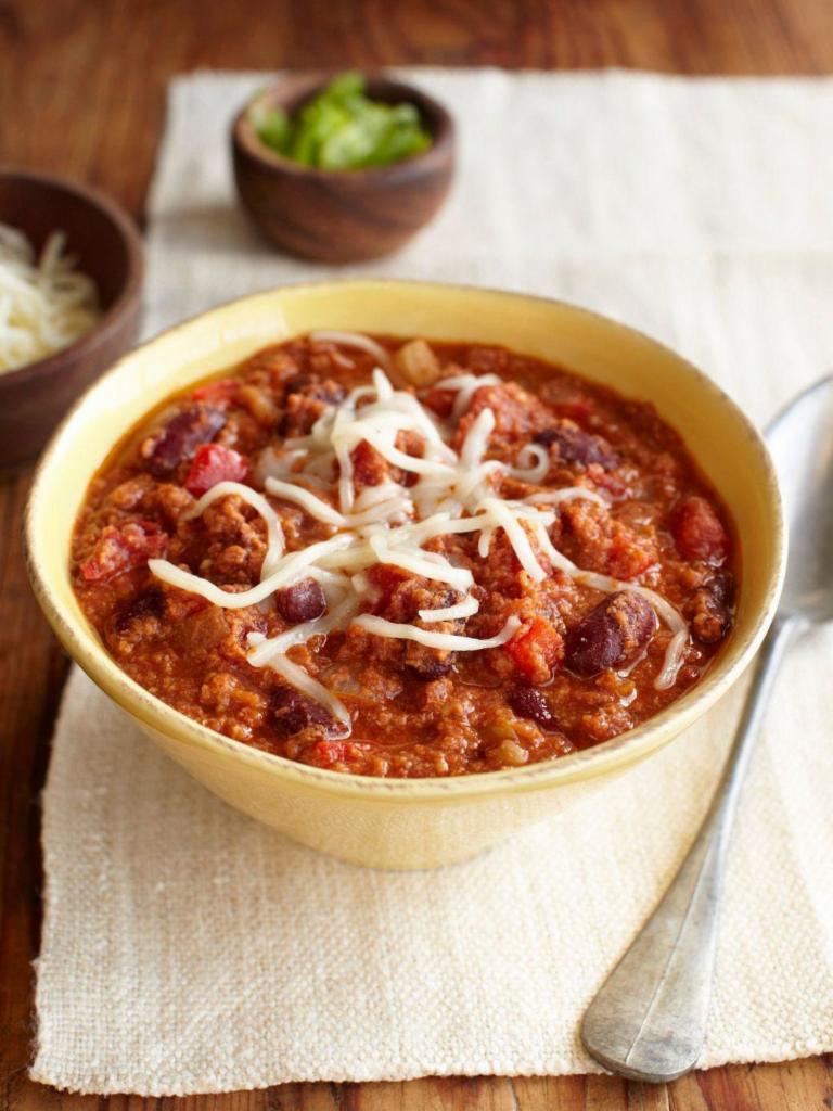 Turkey Chili · A hearty chili made from all-natural ground turkey, tomatoes, red bell peppers and kidney beans simmered with ancho chiles and garlic. Garnished with Jack cheese. Served with sourdough bread. Spicy. Dairy-free and gluten-free.